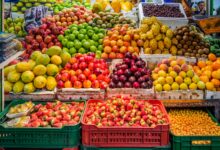 red and green apples on red plastic crate