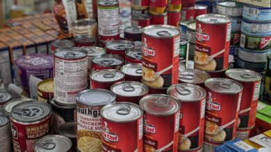 red and white labeled cans