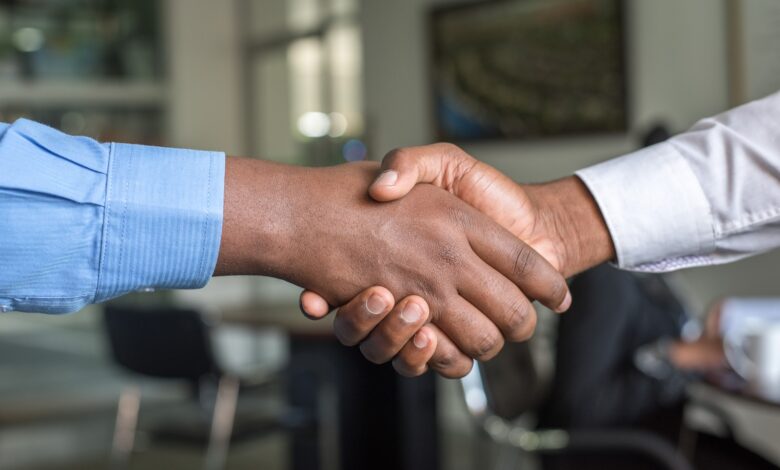 two people shaking hands