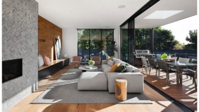 gray sectional couch beside brown wooden table