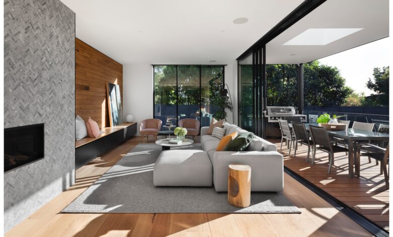 gray sectional couch beside brown wooden table