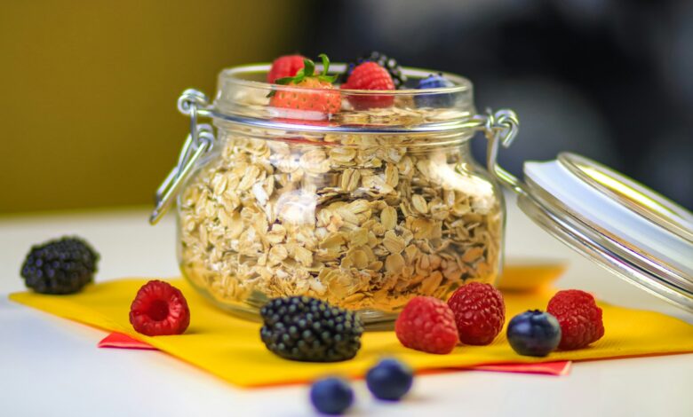 clear glass jar with black berries