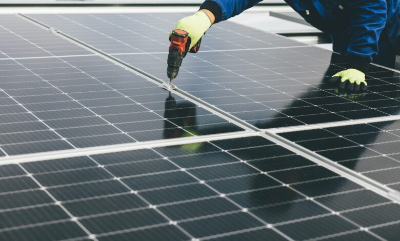 a person working on a solar panel