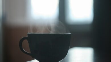 black ceramic teacup on table